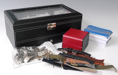 Lot 2082 - A black leather and glass topped fitted watch...