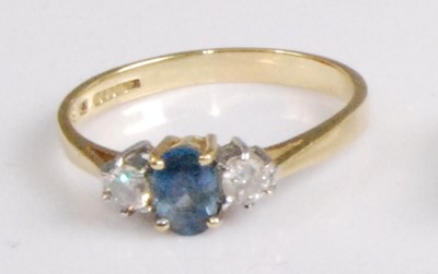 Lot 2083 - A modern 18ct gold, sapphire and diamond three-...