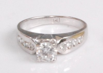 Lot 2182 - A contemporary white metal and cz set dress...