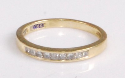 Lot 2183 - An 18ct gold diamond half eternity ring,...