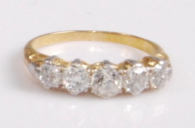 Lot 2184 - A yellow metal diamond five-stone ring, the...