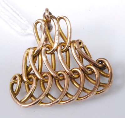 Lot 2172 - A yellow metal brooch, of interwoven...