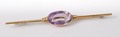 Lot 2222 - An 18ct gold amethyst set bar brooch, of good...