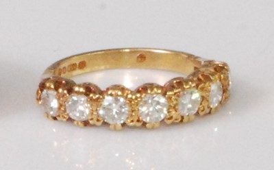 Lot 2261 - A contemporary 18ct gold diamond seven stone...