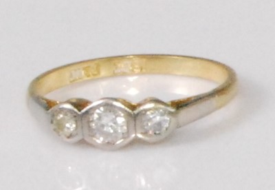 Lot 2269 - An 18ct gold and platinum diamond three stone...