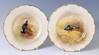 Lot 1067 - A pair of Royal Doulton porcelain cabinet...