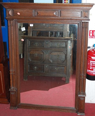 Lot 1121 - A circa 1900 French oak overmantel mirror, the...