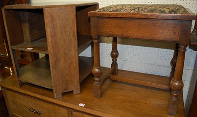 Lot 1142 - A 1930s oak octagonal tiered book table,...