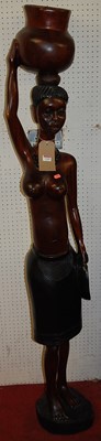 Lot 1145 - A contemporary African carved hardwood...