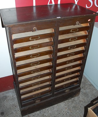 Lot 1165 - An early 20th century oak twin tambour fronted...