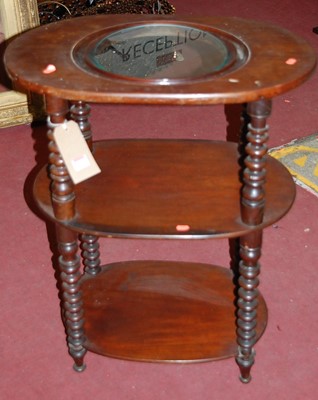 Lot 1172 - A Victorian mahogany oval three-tier wash...
