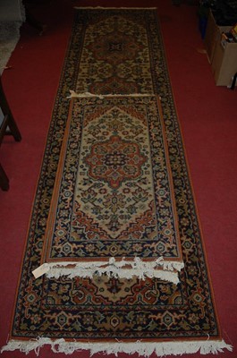 Lot 1177 - A Persian style machine woven long hall runner,...