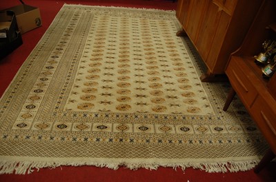 Lot 1185 - A large Persian woollen cream ground Bokhara...