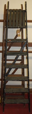 Lot 1188 - A stained wood hinged decorator's ladder;...