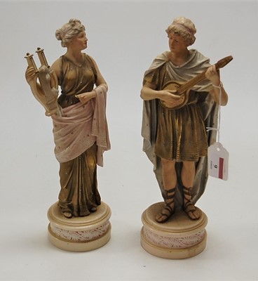 Lot 9 - A pair of Royal Dux type porcelain musician...