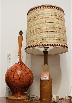 Lot 24 - A 1970s Danish turned teak table lamp, having...