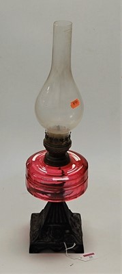 Lot 26 - A late Victorian cast iron pedestal oil lamp,...
