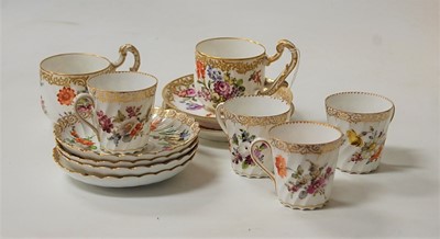 Lot 227 - A set of four Dresden porcelain coffee cans...