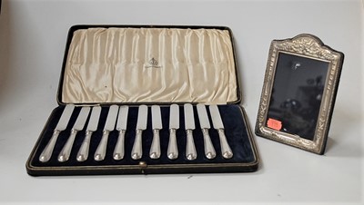 Lot 253 - A modern silver and embossed easel photograph...
