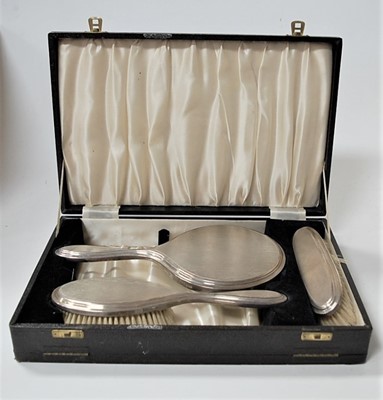 Lot 259 - A cased engine turned silver backed...