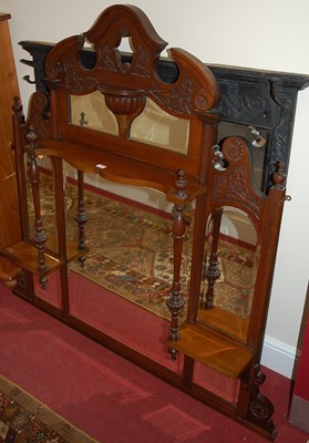 Lot 1196 - An Edwardian floral relief carved bevelled...