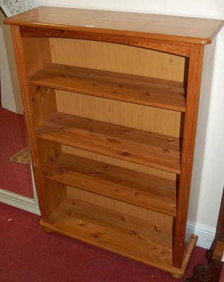 Lot 1197 - A modern pine round cornered freestanding open...