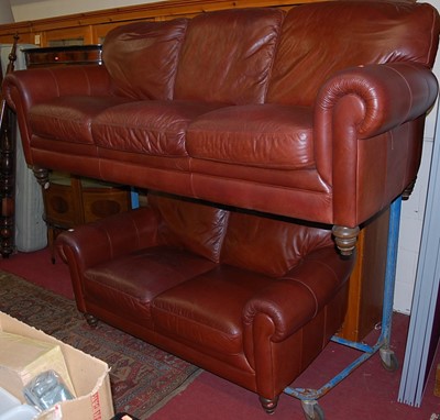 Lot 1207 - A contemporary tan leather two-piece suite,...