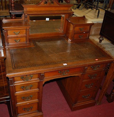 Lot 1222 - An Edwardian walnut kneehole writing desk,...