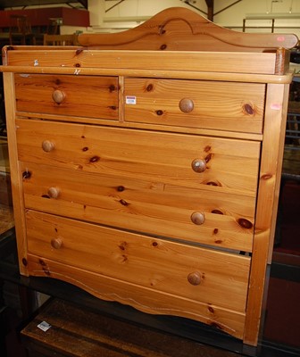 Lot 1228 - A modern pine galleried chest of two short...
