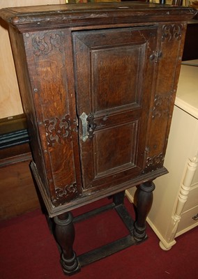 Lot 1251 - An antique oak cupboard on stand, of small...