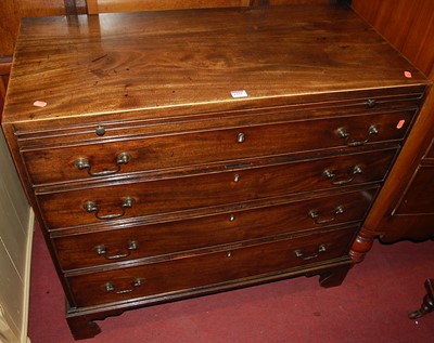 Lot 1255 - An early 19th century mahogany chest, of four...