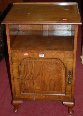 Lot 1256 - A 1930s figured walnut ledgeback single door...