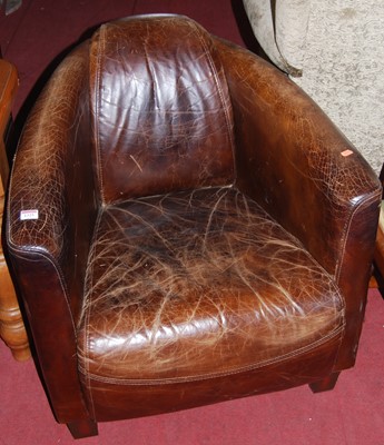 Lot 1325 - A contemporary tan leather pub tub armchair, w....