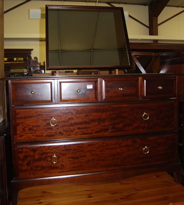 Lot 1357 - A Stag Minstrel mirrorback dressing chest, of...