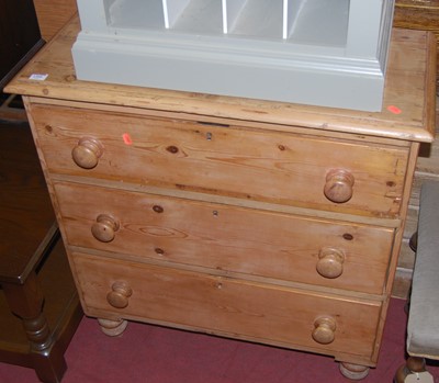 Lot 1368 - A Victorian pine chest of three long drawers,...