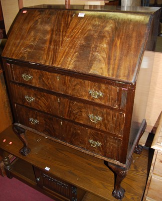 Lot 1369 - A 1920s mahogany and flame mahogany slopefront...