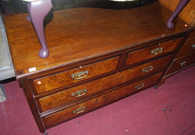 Lot 1375 - An Edwardian walnut low chest, of two short...