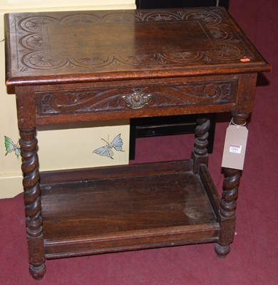 Lot 1392 - A circa 1900 oak floral line carved single...