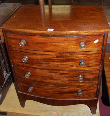 Lot 1402 - A 19th century mahogany bowfront low chest, of...