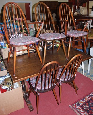 Lot 1405 - An early 20th century oak trestle end dining...