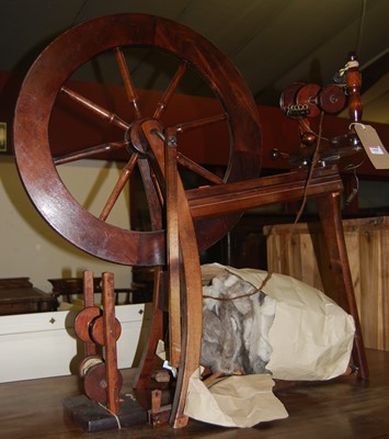 Lot 1408 - A stained beech spinning wheel