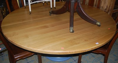 Lot 1410 - A large contemporary light oak topped circular...