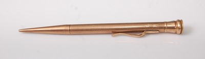 Lot 331 - A 9ct engine turned gold propelling pencil,...