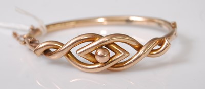 Lot 372 - A Victorian yellow metal hollowed bangle,...