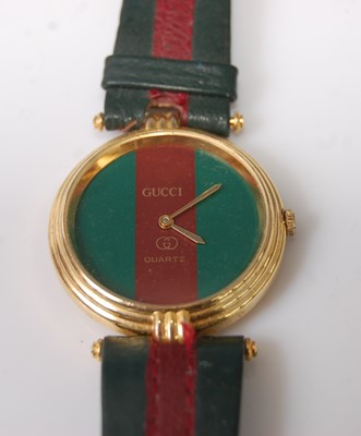 Lot 374 - A Gucci gent's quartz wristwatch, in gilt...