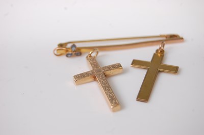 Lot 379 - A 9ct gold and blue stone set safety pin bar...