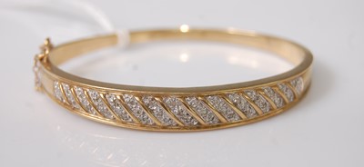 Lot 381 - A modern yellow metal and diamond point set...