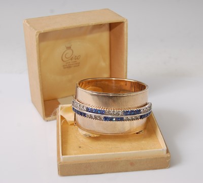 Lot 391 - A Ciro gilt metal and paste set hinged bangle,...