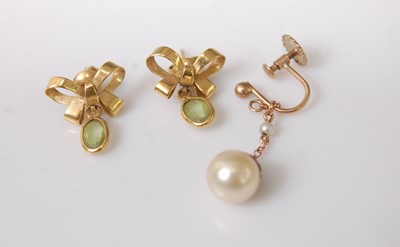 Lot 393 - A pair of yellow metal green peridot set ear...