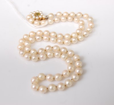 Lot 400 - A knotted cultured pearl single string...